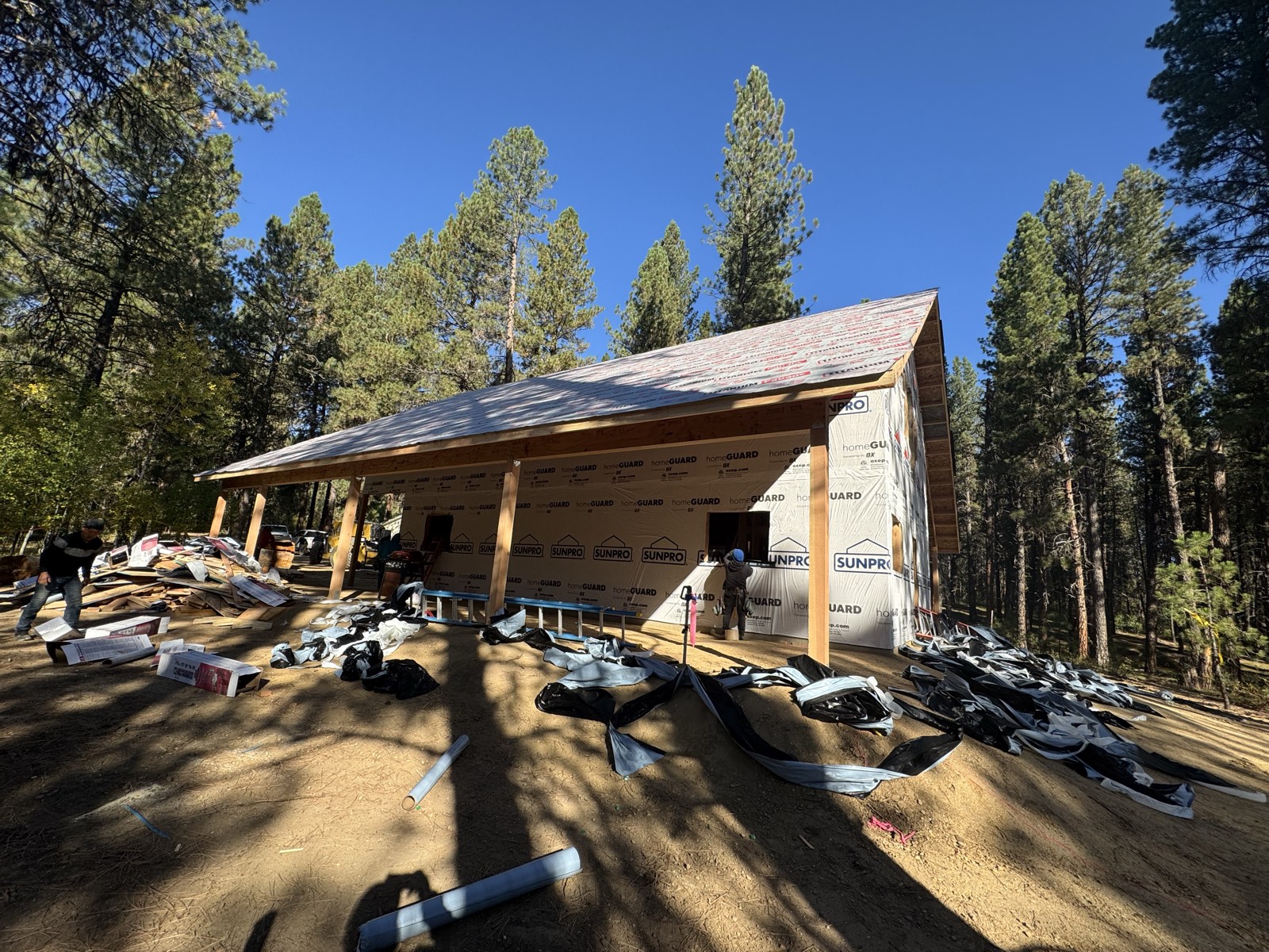 Framed walls rising on the Mountain Cabin custom build in the Idaho mountains