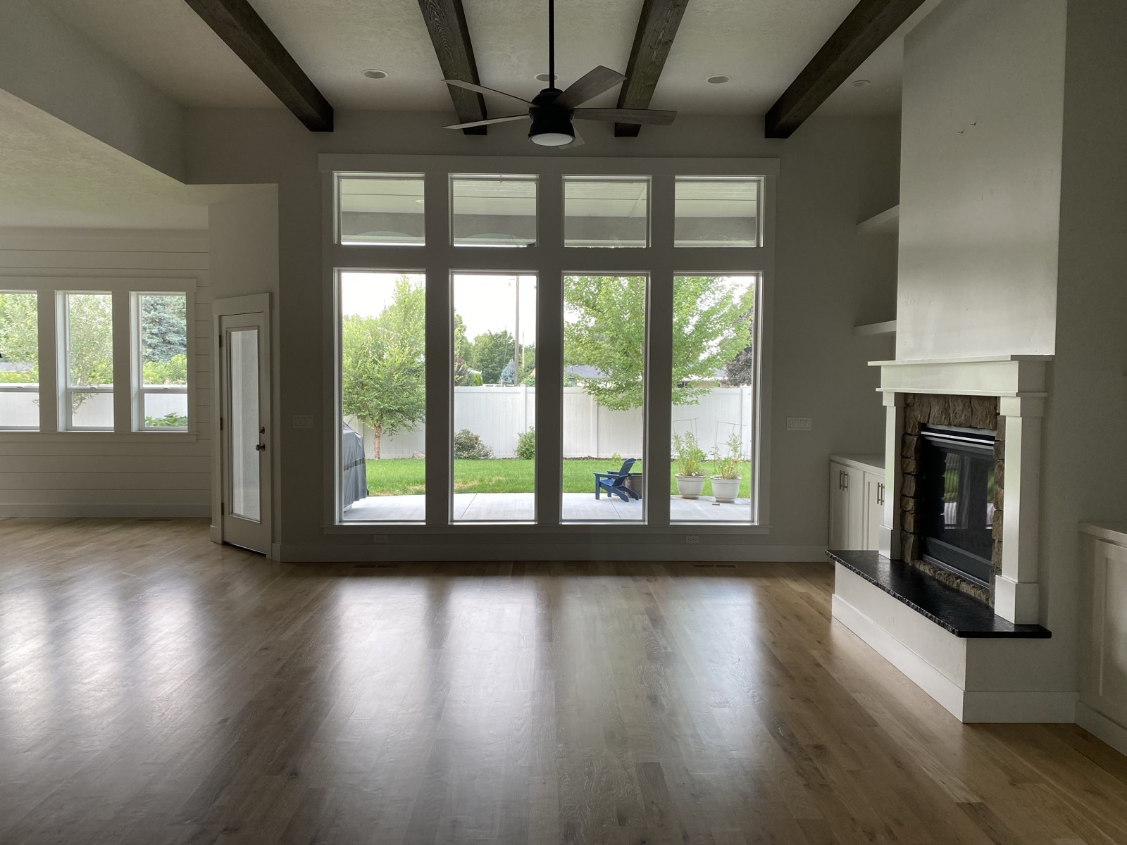 Craftsman custom home great room with exposed wood beams