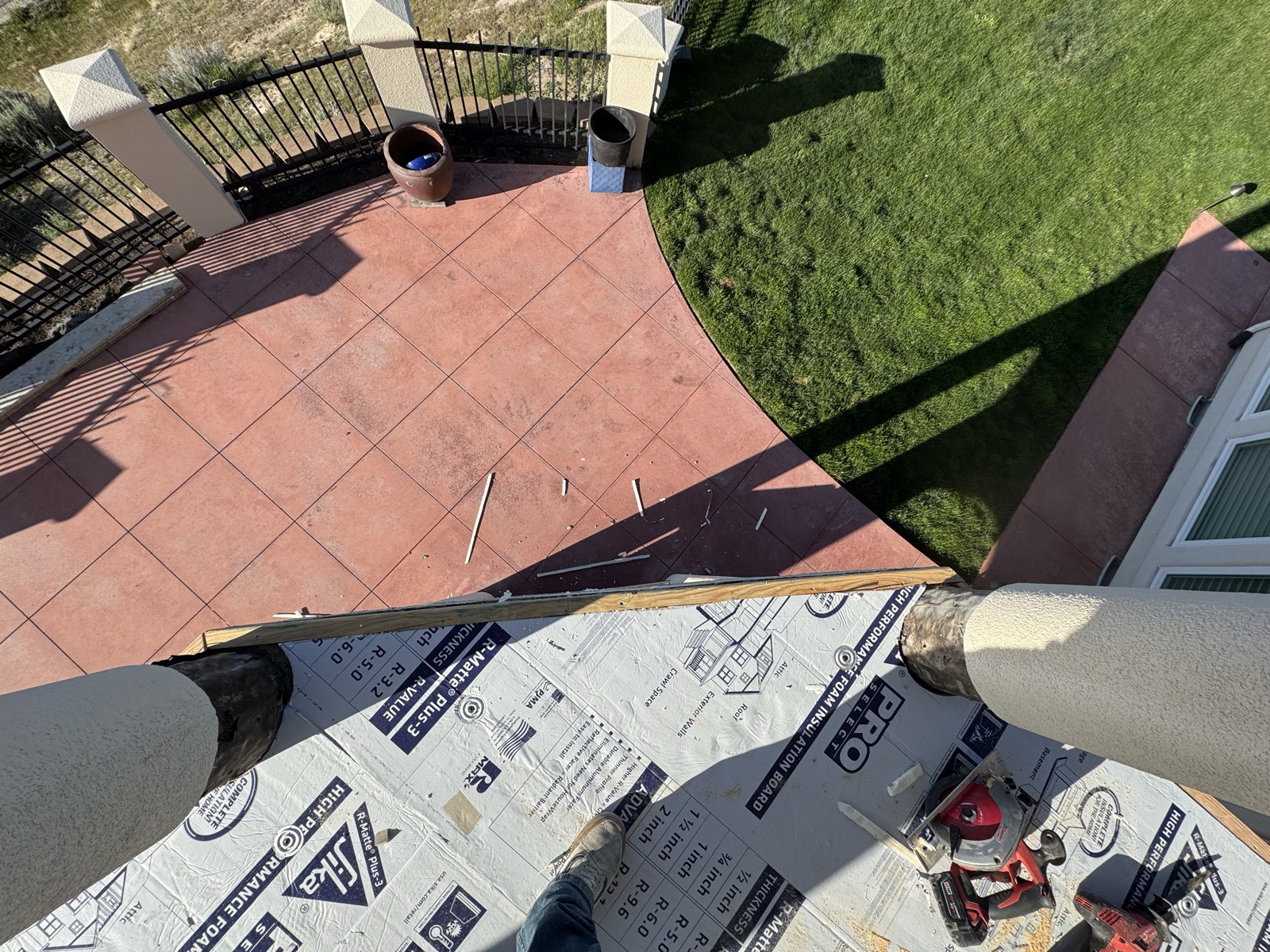 Tile work in progress on a hillside terrace