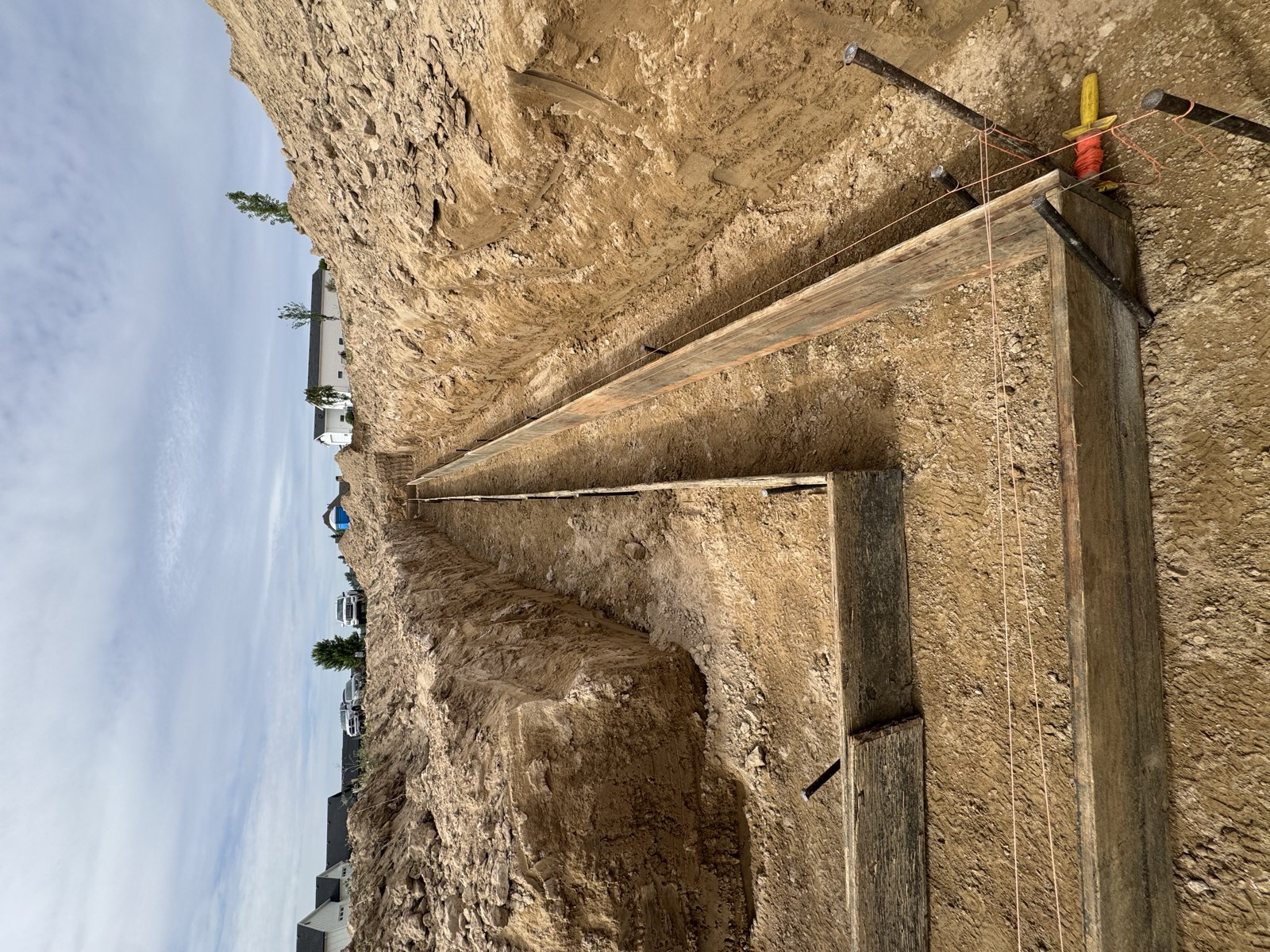 Excavated footing trench prepared for foundation pour