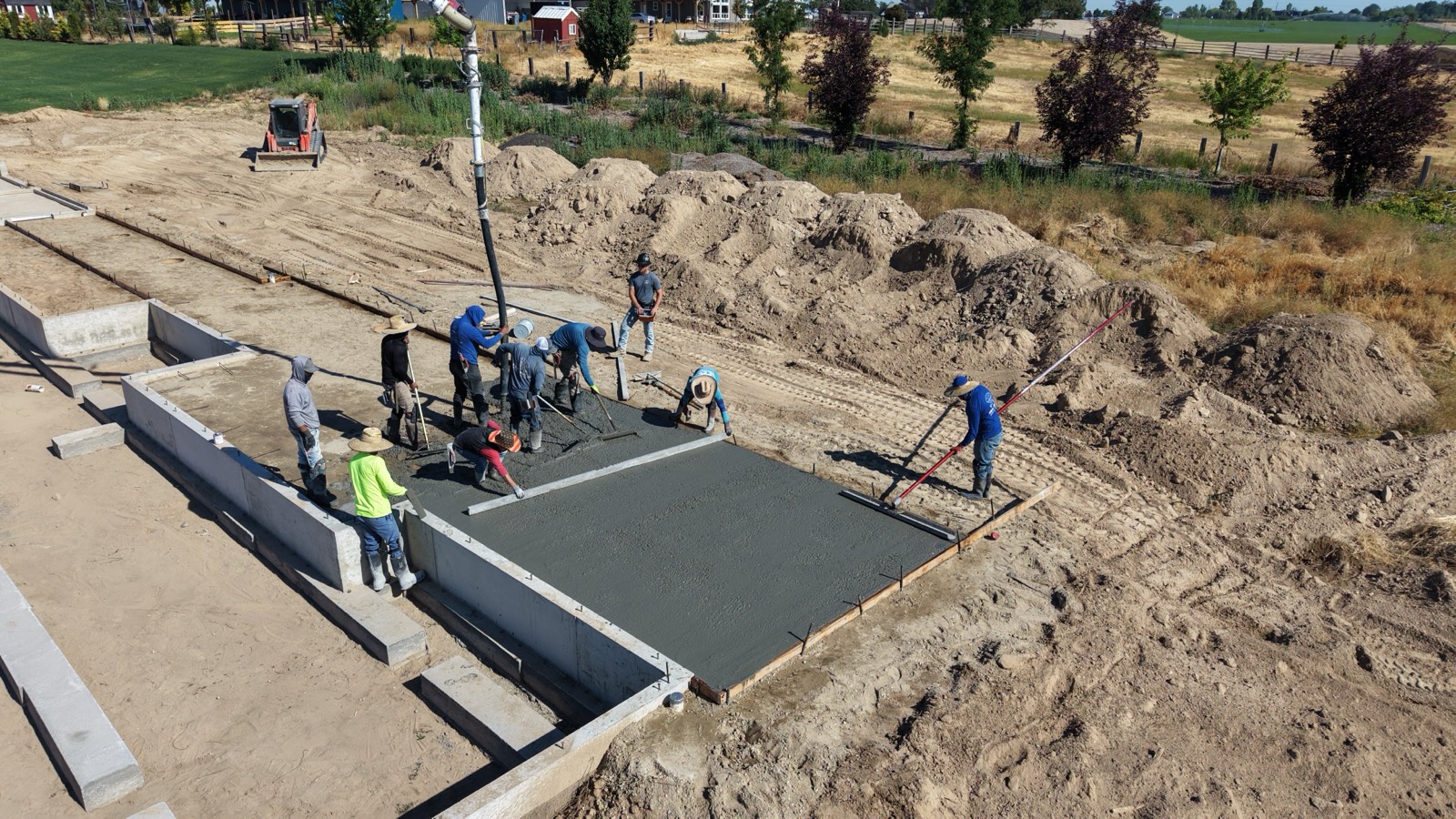Aerial view of concrete placement on a custom home site