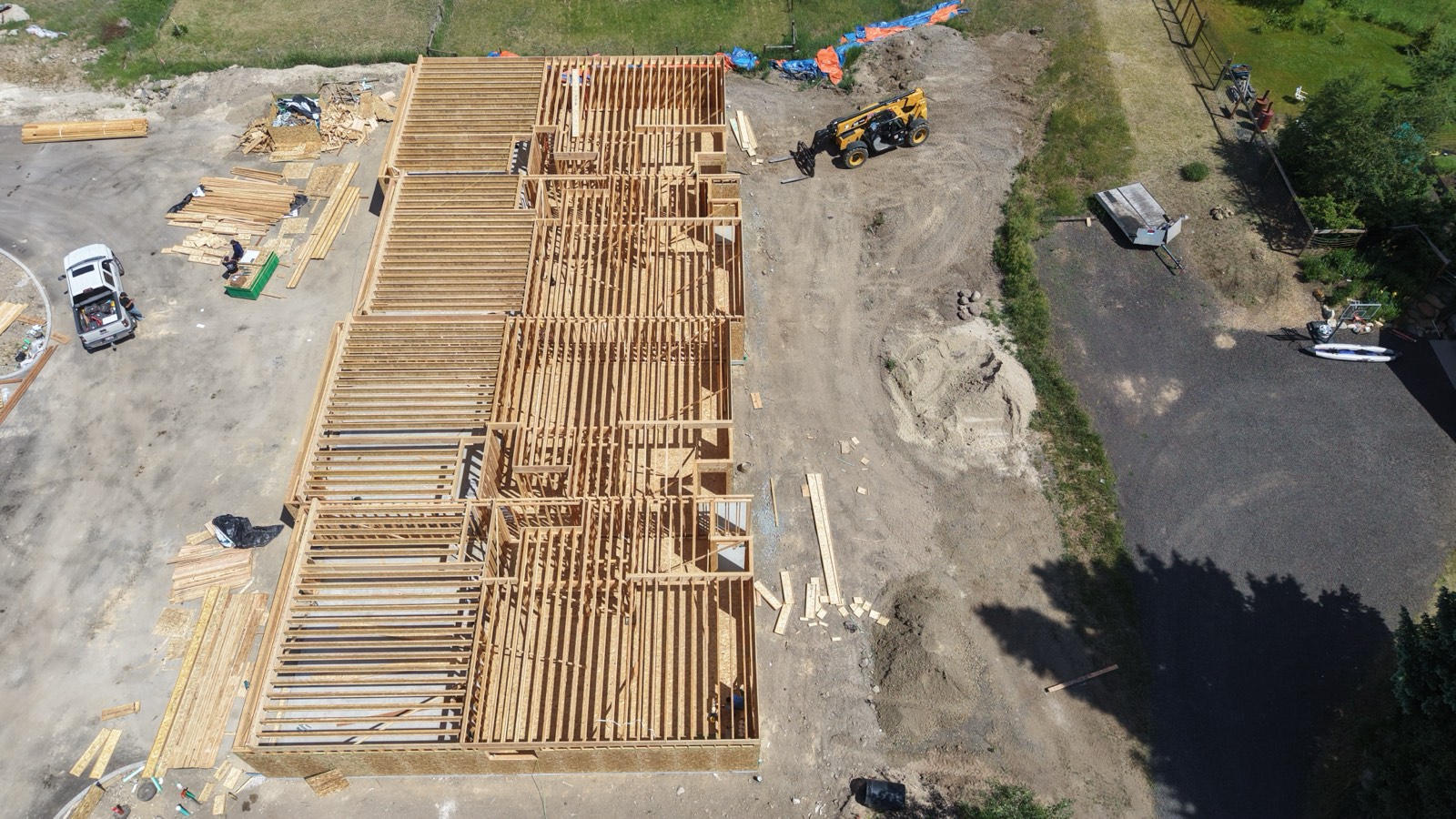 Drone view of a forested Idaho homesite under construction